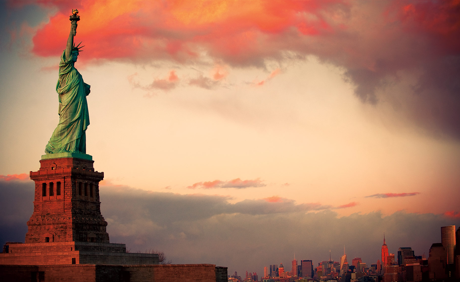 the statue of liberty at sunset, new york postcard.